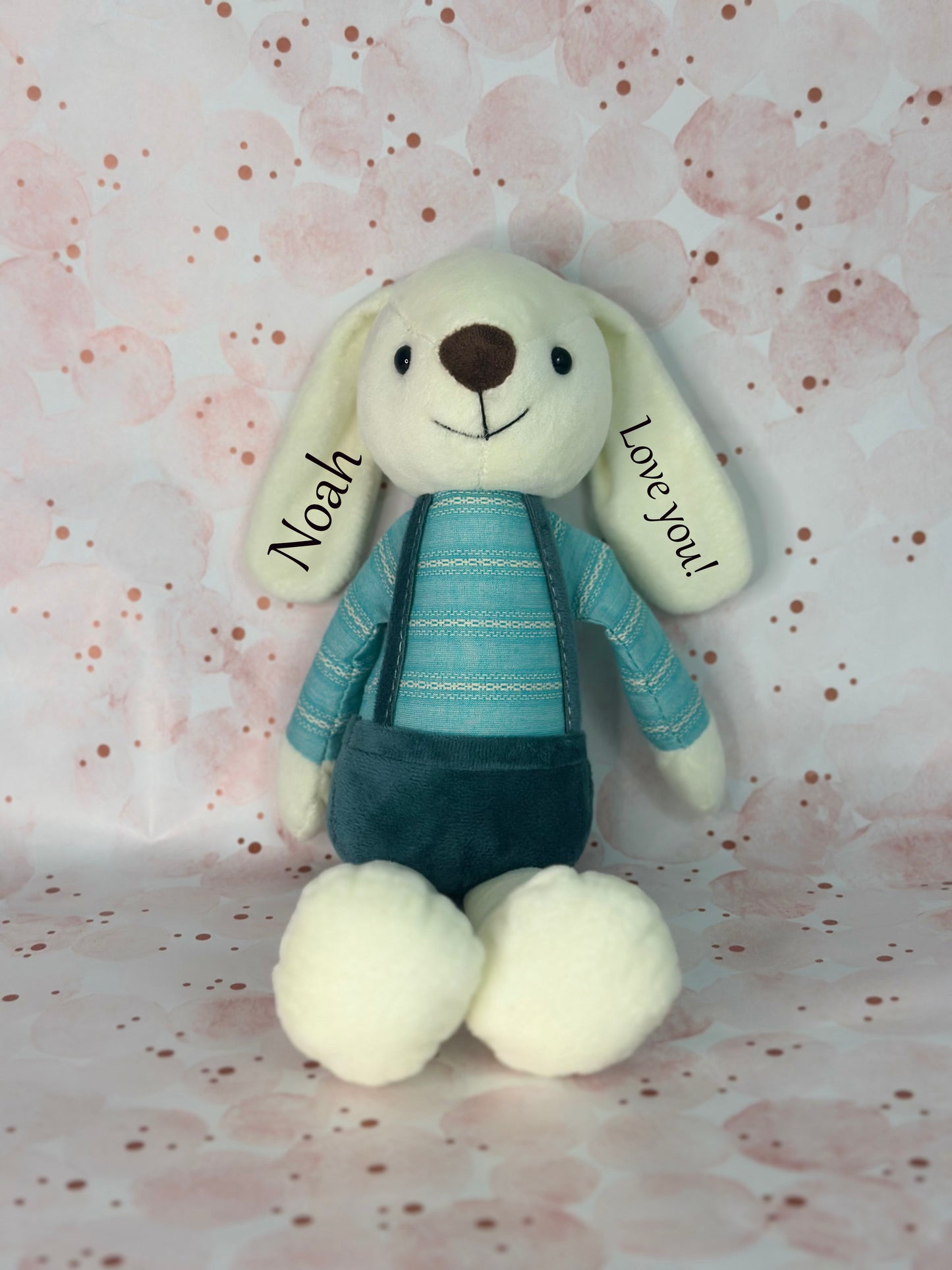 Tuffo Custom Stuffed animal toy with name on a patterned background